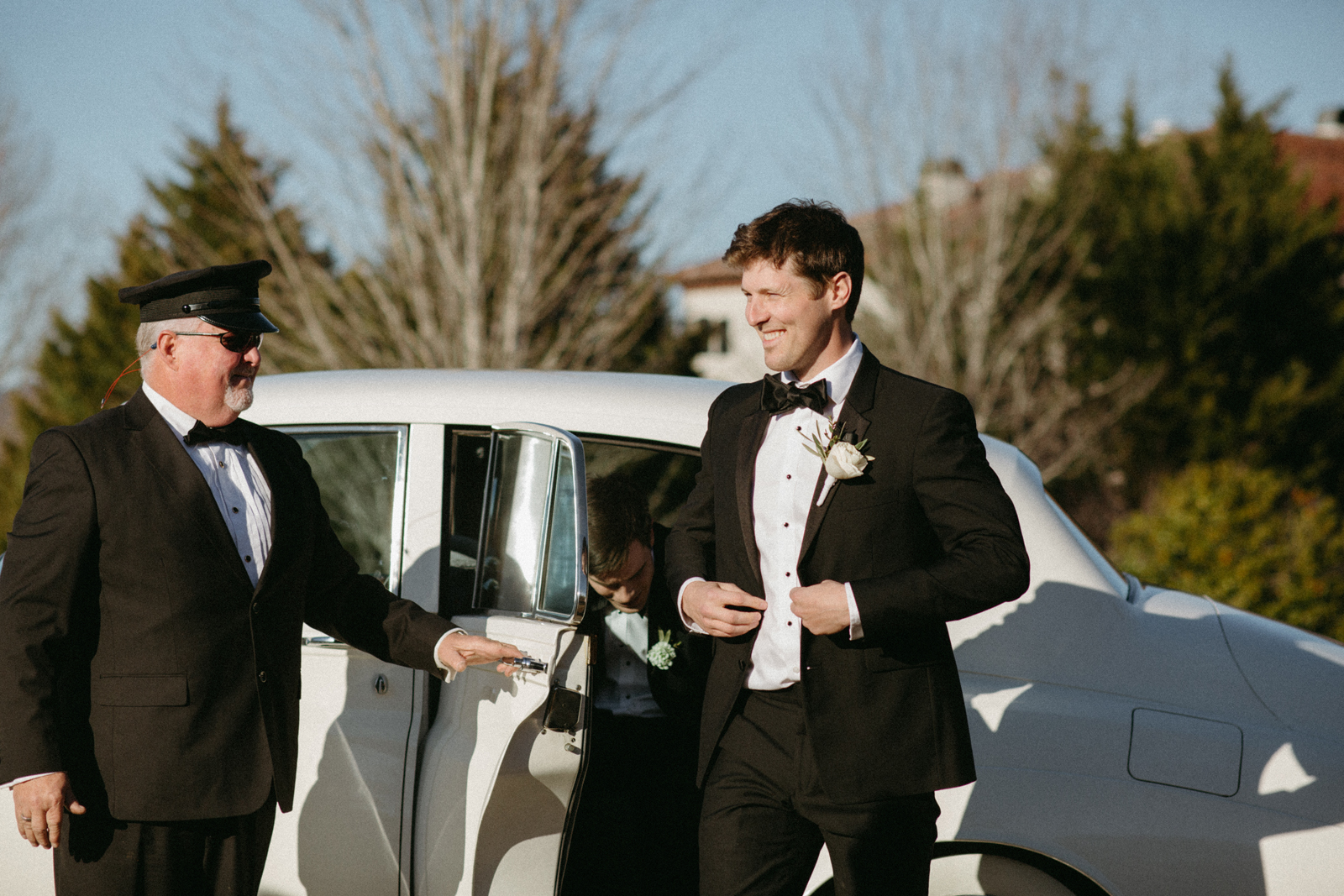 Coats Classic Cars chauffeur opening the door of a Rolls-Royce